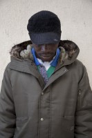 LECCE, ITALY – NOVEMBER 13: Greg, 26 years old from Niger, is portrayed outside the train station of Lecce where a lot of migrants sleep during the night, because of the lack of facilities that could accommodate them in Puglia, Southern Italy on November 13, 2016.