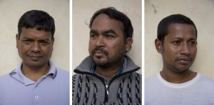 LECCE, ITALY – NOVEMBER 13: Mohan, 26 years old from Bangladesh, Amjad, 36 years old from Pakistan and Deloar, 31 years old from Bangladesh are portrayed outside the train station of Lecce where a lot of migrants sleep during the night, because of the lack of facilities that could accommodate them in Puglia, Southern Italy on November 13, 2016.