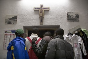 TRICASE, ITALY – NOVEMBER 12: Migrants are seen while they are looking for clothes inside the Caritas of Sant’ Antonio da Padova Church in Puglia, Southern Italy on November 12, 2016.