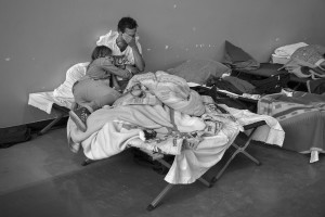 AMATRICE, ITALY – AUGUST 26: A couple crying inside a gym after a strong earthquake hit Amatrice, Italy on August 26, 2016. Italy was struck by a powerful 6.2 magnitude earthquake in the night of August 24, 2016, which has killed at least 297 people and devastated dozens of houses in the Lazio village of Pescara del Tronto, Amatrice and Accumoli.