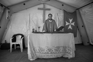 AMATRICE, ITALY – AUGUST 28: Domenico Pompili, Bishop of Rieti is seen during a mass inside a tent in Amatrice, Italy on August 28, 2016. Italy was struck by a powerful, 6.2 magnitude earthquake in the night of August 24, 2016, which has killed about 297 people and devastated dozens of houses in the Lazio village of Amatrice, Pescara del Tronto and Accumoli.