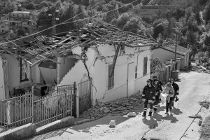 PESCARA DEL TRONTO, ITALY – AUGUST 25: A woman with fire fighters reach her destroyed house after a strong earthquake hit Pescara del Tronto, Italy on August 25, 2016. Italy was struck by a powerful, 6.2 magnitude earthquake in the night of August 24, 2016, which has killed at least 297 people and devastated dozens of houses in the Lazio village of Pescara del Tronto, Accumoli and Amatrice.