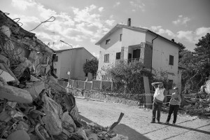 AMATRICE, ITALY – AUGUST 26: People looks at buildings destroyed in Amatrice, in Italy on August 26, 2016. Italy was struck by a powerful, 6.2 magnitude earthquake in the night of August 24, 2016, which has killed at least 297 people and devastated dozens of houses in the Lazio village of Pescara del Tronto, Accumoli and Amatrice.