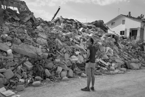 AMATRICE, ITALY – AUGUST 26: A man looks at destroyed buildings in Amatrice, in Italy on August 26, 2016. Italy was struck by a powerful, 6.2 magnitude earthquake in the night of August 24, 2016, which has killed at least 297 people and devastated dozens of houses in the Lazio village of Amatrice, Pescara del Tronto and Accumoli.