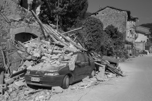 PESCARA DEL TRONTO, ITALY – AUGUST 25: A damaged car is seen after a strong earthquake hit Pescara del Tronto, Italy on August 25, 2016. Italy was struck by a powerful, 6.2-magnitude earthquake in the night, which has killed at least 297 people and devastated dozens of houses in the Lazio village of Pescara del Tronto.