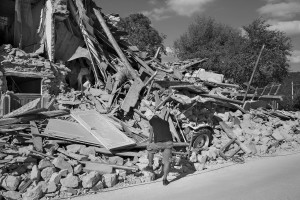 PESCARA DEL TRONTO, ITALY – AUGUST 25: A man stands near a destroyed building after a strong earthquake hit Pescara del Tronto, Italy on August 25, 2016. Italy was struck by a powerful, 6.2-magnitude earthquake in the night, which has killed at least 297 people and devastated dozens of houses in the Lazio village of Pescara del Tronto.