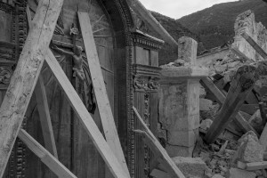 NORCIA, ITALY, NOVEMBER 2: A crucifix is seen in the collapsed San Salvatore church in the village of Campi near Norcia, in Italy, on November 2, 2016. A 6.5 magnitude earthquake hit central Italy on October 30, 2016.