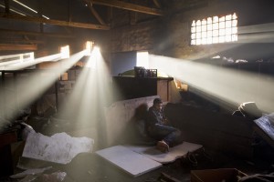 A migrant rests inside an abandoned warehouse where he and other migrants took refuge in Belgrade, Serbia on February 5, 2017. Hundreds of migrants have been sleeping in freezing conditions in central Belgrade looking for ways to cross the heavily guarded EU borders.