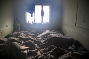 Migrants sleep on the ground of an abandoned warehouse where they took refuge in Belgrade, Serbia on February 4, 2017. Hundreds of migrants have been sleeping rough in freezing conditions in central Belgrade looking for ways to cross the heavily guarded EU borders.