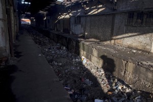 A shadow shows a migrant walking inside an abandoned warehouse in Belgrade, Serbia on February 5, 2017. Hundreds of migrants have been sleeping in freezing conditions in downtown Belgrade looking for ways to cross the heavily guarded EU borders.