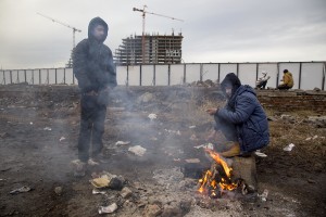 Migrants gather around a fire to warm themselves from the morning cold outside an abandoned warehouse where they are taking refuge, in Belgrade, Serbia on February 3, 2017. Hundreds of migrants have been sleeping in freezing conditions in central Belgrade looking for ways to cross the heavily guarded EU borders.