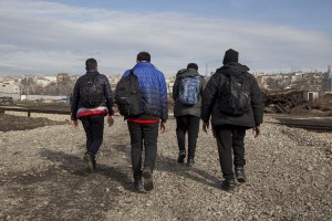 Migrants leave the abandoned warehouse where they stayed for several months to reach the border with Hungary and groped to cross it in Belgrade, Serbia on February 3, 2017. Hundreds of migrants have been sleeping in freezing conditions in downtown Belgrade looking for ways to cross the heavily guarded EU borders.