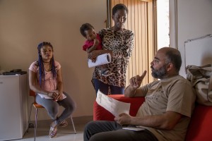 Marco Milano, coordinator of Petruro Irpino Sprar (Protection systems for asylum seekers and refugees) speaks with some migrants inside the headquarters of the Sprar in Petruro Irpino, southern Italy on June 14, 2017. Petruro Irpino is an Italian small village with 367 inhabitants in the province of Avellino in Campania, which is claiming to be an efficient model of integration and where people of different religions and coming from different parts in the world peaceful live together.