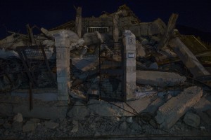 A collapsed building is seen almost one year after the earthquake in the village of Amatrice, central Italy on August 2, 2017. Italy was struck by a powerful 6.2 magnitude earthquake in the night of August 24, 2016 which has killed at least 297 people and devastated dozens of houses in the Lazio village of Amatrice and other Amatrice fractions.