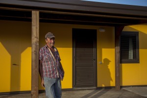 Enrico Laureti, 62 years old is portrayed outside the new house where he lives after his old one was destroyed by the earthquake of almost one year ago in the village of Retrosi, central Italy on August 2, 2017. Italy was struck by a powerful 6.2 magnitude earthquake in the night of August 24, 2016 which has killed at least 297 people and devastated dozens of houses in the Lazio village of Amatrice and other Amatrice fractions.