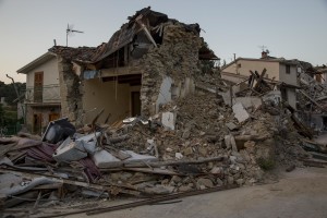 A collapsed building is seen almost one year after the earthquake in the village of Libertino, central Italy on August 1, 2017. Italy was struck by a powerful 6.2 magnitude earthquake in the night of August 24, 2016 which has killed at least 297 people and devastated dozens of houses in the Lazio village of Amatrice and other Amatrice fractions.