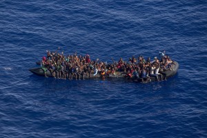 A picture taken from the moonbird aircraft of the German NGO Sea-Watch shows hundreds of migrants inside a rubber dinghy while they try to reach Europe in the Mediterranean Sea on September 15, 2017.