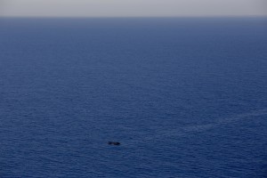 A picture taken from the moonbird aircraft of the German NGO Sea-Watch shows hundreds of migrants inside a rubber dinghy while they try to reach Europe in the Mediterranean Sea on September 15, 2017.