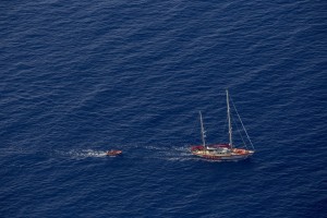 A picture taken from the moonbird aircraft of the German NGO Sea-Watch shows the migrants rescue operations of the Spanish NGO Open Arms in the Mediterranean sea on September 15, 2017.