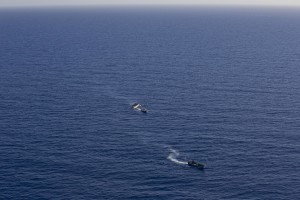 A picture taken from the moonbird aircraft of the German NGO Sea-Watch shows hundreds of migrants inside a rubber dinghy probably intercepted by Libyan militaries while they tried to reach Europe in the Mediterranean Sea on September 15, 2017.