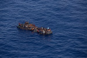 A picture taken from the moonbird aircraft of the German NGO Sea-Watch shows hundreds of migrants inside a rubber dinghy while they try to reach Europe in the Mediterranean Sea on September 15, 2017.