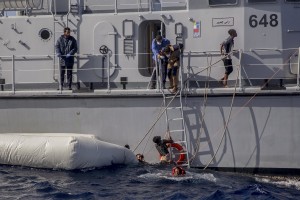 The Libyan Coast Guard tries to recover migrants from a rubber dinghy in the Mediterranean Sea on November 6, 2017. During a shipwreck, five people died, including a newborn child. According to the German NGO Sea-Watch, which has saved 58 migrants, the violent behavior of the Libyan coast guard caused the death of five persons.