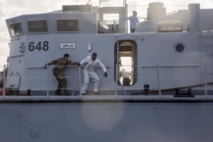 A migrant tries to escape from the Libyan Coast Guard ship after being rescued by them in the Mediterranean Sea on November 6, 2017. During a shipwreck, five people died, including a newborn child. According to the German NGO Sea-Watch, which has saved 58 migrants, the violent behavior of the Libyan coast guard caused the death of five persons. Alessio Paduano