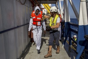 A migrant rescued by members of German NGO Sea-Watch in the Mediterranean Sea on November 6, 2017. During a shipwreck, five people died, including a newborn child. According to the German NGO Sea-Watch, which has saved 58 migrants, the violent behavior of the Libyan coast guard caused the death of five persons. Alessio Paduano/AFP