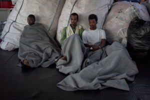 Migrants are seen on board of German NGO Sea-Watch ship after their rescue in the Mediterranean Sea on November 6, 2017. During the shipwreck November 6,2017 five people died, including a newborn child. According to Sea-Watch, which has saved 58 migrants, the violent behavior of the Libyan coast guard caused the death of five persons. Sea-Watch is a non-governmental organisation founded on May, 19 2015 and is formally registered as a non-profit organisation in Berlin.