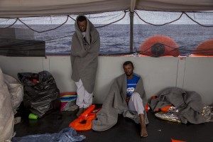 Migrants are seen on board of German NGO Sea-Watch ship after their rescue in the Mediterranean Sea on November 7, 2017. During the shipwreck November 6,2017 five people died, including a newborn child. According to Sea-Watch, which has saved 58 migrants, the violent behavior of the Libyan coast guard caused the death of five persons. Sea-Watch is a non-governmental organisation founded on May, 19 2015 and is formally registered as a non-profit organisation in Berlin.