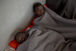 Migrants are seen on board of German NGO Sea-Watch ship after their rescue in the Mediterranean Sea on November 7, 2017. During the shipwreck November 6,2017 five people died, including a newborn child. According to Sea-Watch, which has saved 58 migrants, the violent behavior of the Libyan coast guard caused the death of five persons. Sea-Watch is a non-governmental organisation founded on May, 19 2015 and is formally registered as a non-profit organisation in Berlin.