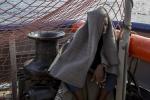 A migrant is seen on board of German NGO Sea-Watch ship after his rescue in the Mediterranean Sea on November 7, 2017. During the shipwreck November 6,2017 five people died, including a newborn child. According to Sea-Watch, which has saved 58 migrants, the violent behavior of the Libyan coast guard caused the death of five persons. Sea-Watch is a non-governmental organisation founded on May, 19 2015 and is formally registered as a non-profit organisation in Berlin.