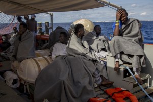 Migrants are seen on board of German NGO Sea-Watch ship after their rescue in the Mediterranean Sea on November 7, 2017. During the shipwreck November 6,2017 five people died, including a newborn child. According to Sea-Watch, which has saved 58 migrants, the violent behavior of the Libyan coast guard caused the death of five persons. Sea-Watch is a non-governmental organisation founded on May, 19 2015 and is formally registered as a non-profit organisation in Berlin.