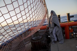 A migrant is seen on board of German NGO Sea-Watch ship after his rescue in the Mediterranean Sea on November 7, 2017. During the shipwreck November 6,2017 five people died, including a newborn child. According to Sea-Watch, which has saved 58 migrants, the violent behavior of the Libyan coast guard caused the death of five persons. Sea-Watch is a non-governmental organisation founded on May, 19 2015 and is formally registered as a non-profit organisation in Berlin.