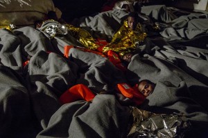 Migrants are seen on board of German NGO Sea-Watch ship after their rescue in the Mediterranean Sea on November 7, 2017. During the shipwreck November 6,2017 five people died, including a newborn child. According to Sea-Watch, which has saved 58 migrants, the violent behavior of the Libyan coast guard caused the death of five persons. Sea-Watch is a non-governmental organisation founded on May, 19 2015 and is formally registered as a non-profit organisation in Berlin.