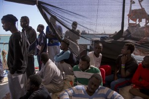 Migrants are seen on board of German NGO Sea-Watch ship after their rescue in the Mediterranean Sea on November 8, 2017. During the shipwreck November 6,2017 five people died, including a newborn child. According to Sea-Watch, which has saved 58 migrants, the violent behavior of the Libyan coast guard caused the death of five persons. Sea-Watch is a non-governmental organisation founded on May, 19 2015 and is formally registered as a non-profit organisation in Berlin.