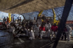 Migrants are seen on board of German NGO Sea-Watch ship after their rescue in the Mediterranean Sea on November 8, 2017. During the shipwreck November 6,2017 five people died, including a newborn child. According to Sea-Watch, which has saved 58 migrants, the violent behavior of the Libyan coast guard caused the death of five persons. Sea-Watch is a non-governmental organisation founded on May, 19 2015 and is formally registered as a non-profit organisation in Berlin.