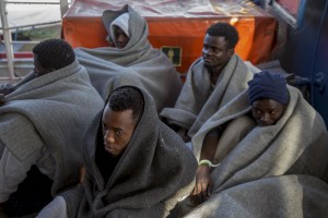 Migrants are seen on board of German NGO Sea-Watch ship after their rescue in the Mediterranean Sea on November 8, 2017. During the shipwreck November 6,2017 five people died, including a newborn child. According to Sea-Watch, which has saved 58 migrants, the violent behavior of the Libyan coast guard caused the death of five persons. Sea-Watch is a non-governmental organisation founded on May, 19 2015 and is formally registered as a non-profit organisation in Berlin.