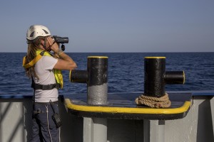 A Sea-Watch crew member looking for rubber dinghy with migrants on board during a rescue operation in the Mediterranean sea on November 6, 2017. Sea-Watch is a non-governmental organisation founded on May, 19 2015 and is formally registered as a non-profit organisation in Berlin.