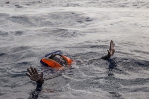 A migrant tries to board a boat of the German NGO Sea-Watch in the Mediterranean Sea on November 6, 2017. During a shipwreck, five people died, including a newborn child. According to the German NGO Sea-Watch, which has saved 58 migrants, the violent behavior of the Libyan coast guard caused the death of five persons. Alessio Paduano