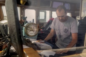 Captain of NGO Proactiva Open Arms rescue boat Marc Reig Creus at work in the Mediterranean sea on July 17, 2018.