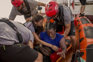 NBA Memphis player Marc Gasol and members of the Spanish NGO Proactiva Open Arms rescue boat carry Josepha, an African migrant from Cameroon, in the Mediterranean sea on July 17, 2018.
