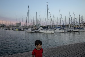 A child is seen in the port of Barcelona, Spain on July 12, 2018.
