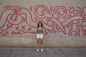 Ciara, 20 years old is portrayed near a mural outside Centre de Cultura Contemporània in the Raval district in Barcelona, Spain on July 11, 2018. The Raval is one of the most multicultural and colorful neighborhoods in the city and it hosts numerous artists and galleries.