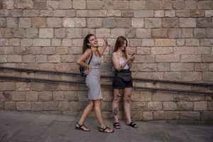 Girls have fun in a street of the Raval district in Barcelona, Spain on July 12, 2018. The Raval is one of the most multicultural and colorful neighborhoods in the city and it hosts numerous artists and galleries.