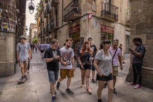 People walk in the streets of El Born district in Barcelona, Spain on July 11, 2018. El Born is a district with an aristocratic past that today has become a cultural area in continuous development, inhabited by a lively community of creative people and where lots of art galleries are located.