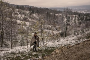 A migrant walks in a wood in the outskirts of the Bosnian city of Bihać, Bosnia and Herzegovina on November 28, 2018.