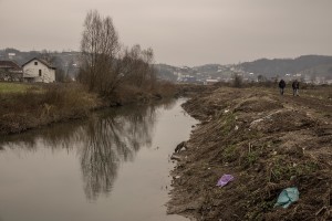 Migrants walk outise a refugee
 camp in Velika Kladusa, Bosnia and Herzegovin on November 30, 2018.