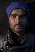 Rahin, 20 years old from Dhaka, Bangladesh is portrayed outiside a reception center in Velika Kladusa, Bosnia and Herzegovina on November 30, 2018.