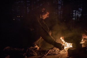 A migrant prepares food with a fire outside an abandoned building in the outskirts of the Bosnian city of Bihać, Bosnia and Herzegovina on November 28, 2018.